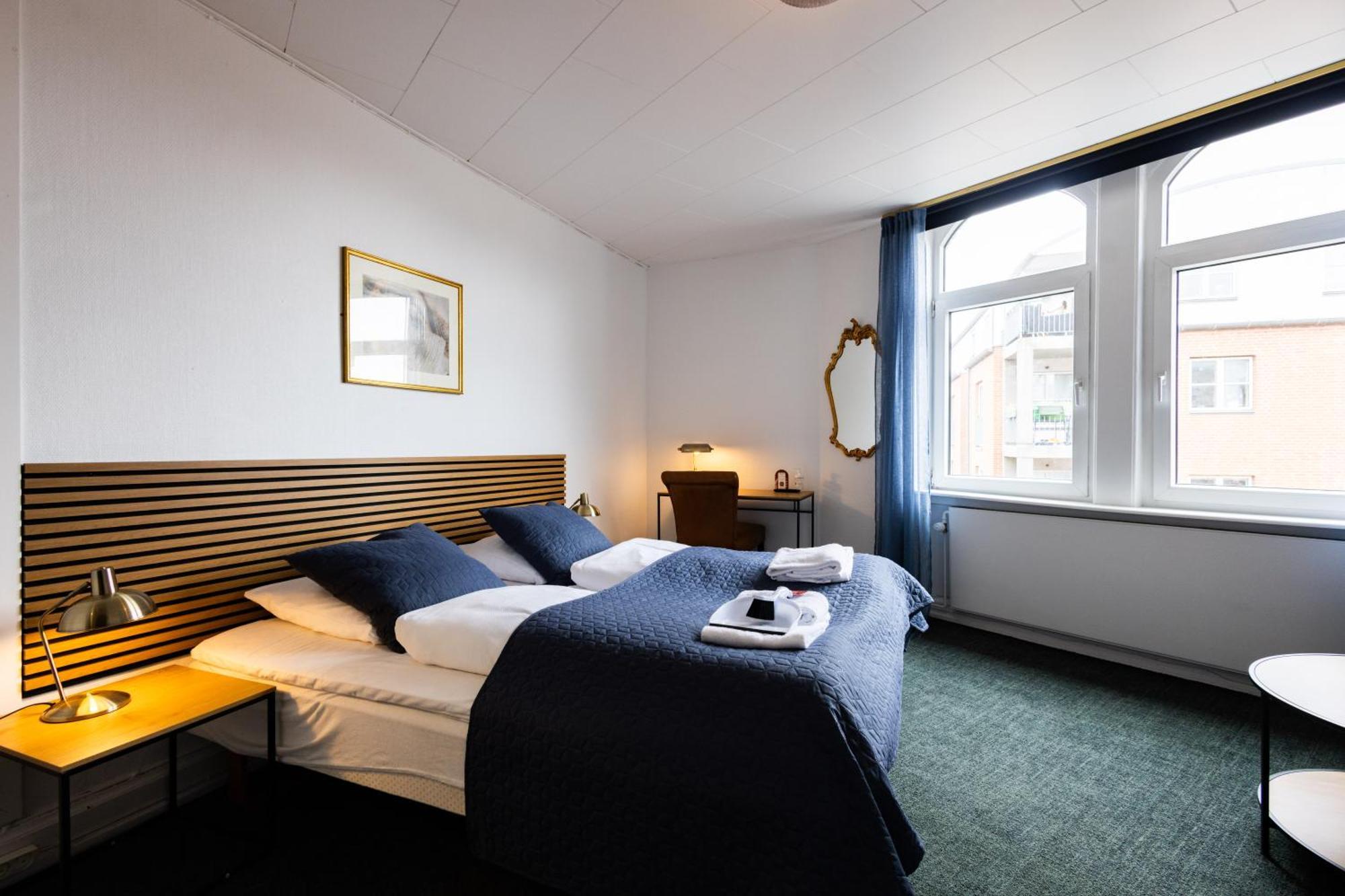 Tweepersoonskamer met 1 of 2 Bedden en een Extra Bed